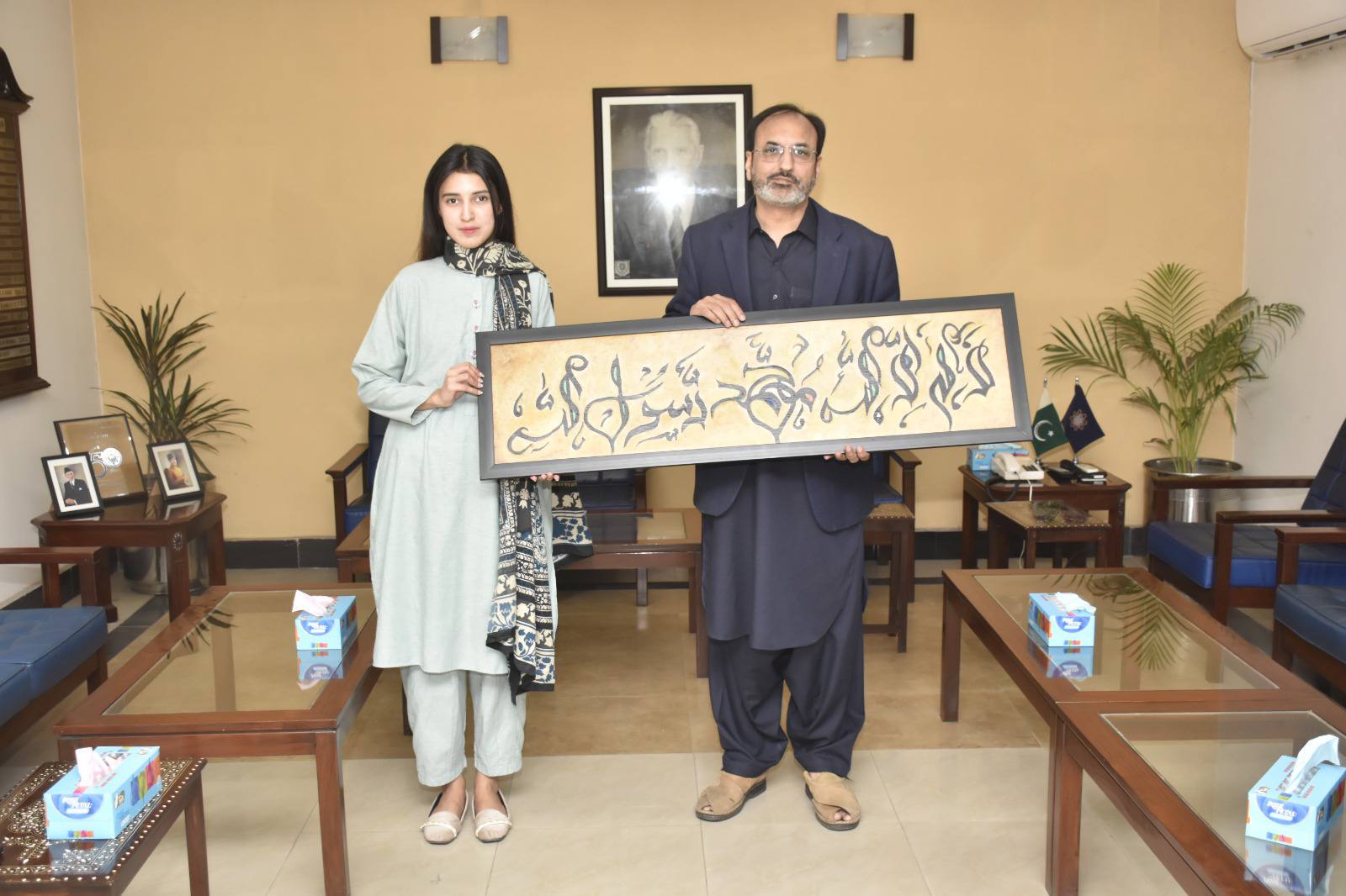 Manal Tariq (2022-PID-4) a student from the Department of Product and Industrial Design (PID) at UET Lahore is seen presenting her calligraphy artwork to Vice Chancellor Prof. Dr. Shahid Munir (TI).